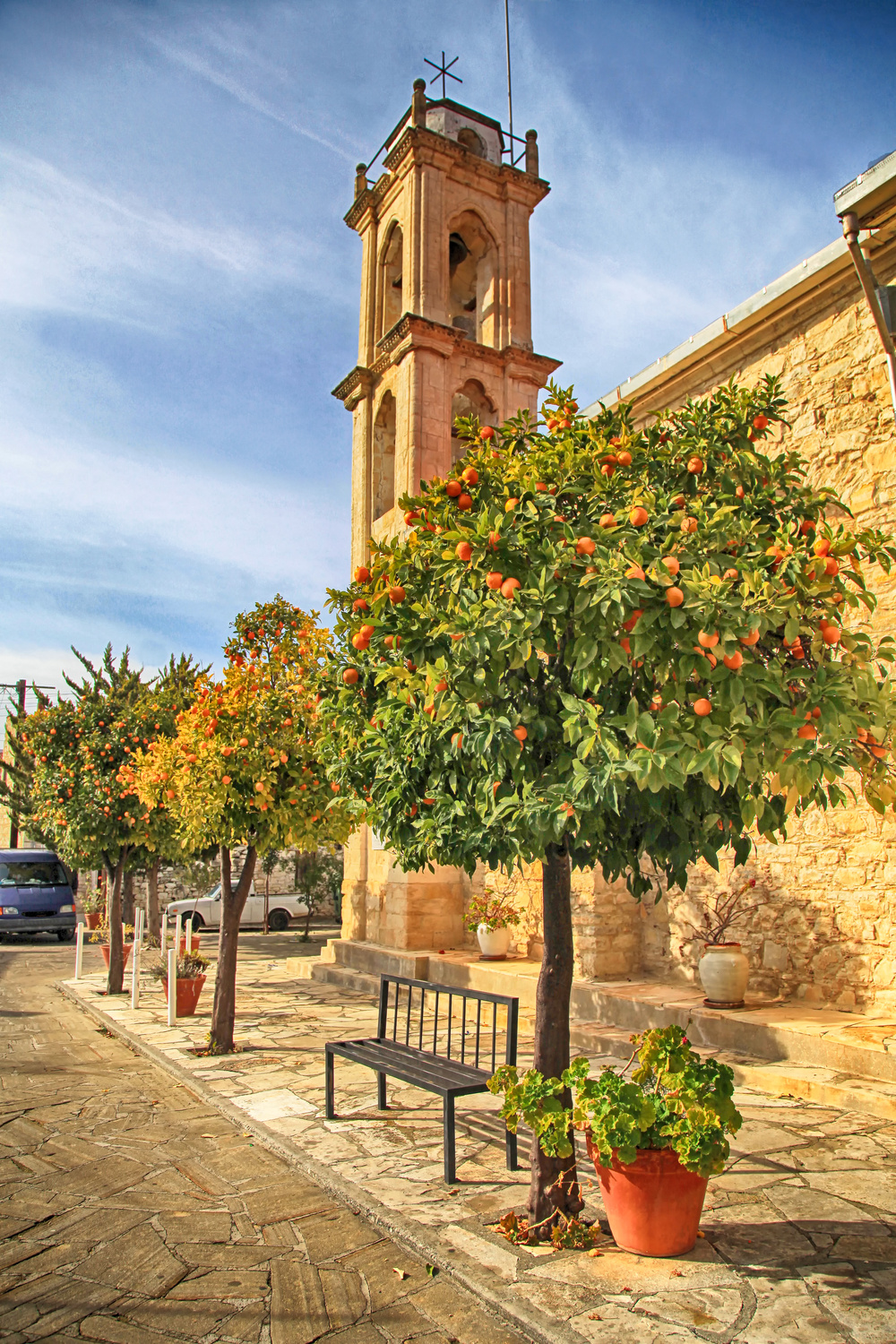 orange trees and church in picturesque village Laneia (Lania), Cyprus